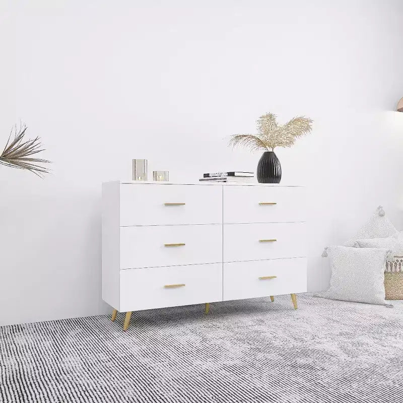 Commode à 6 tiroirs Okak avec poignées dorées et pieds en acier, grands tiroirs spacieux, meuble de rangement élégant pour l'organisation de la maison