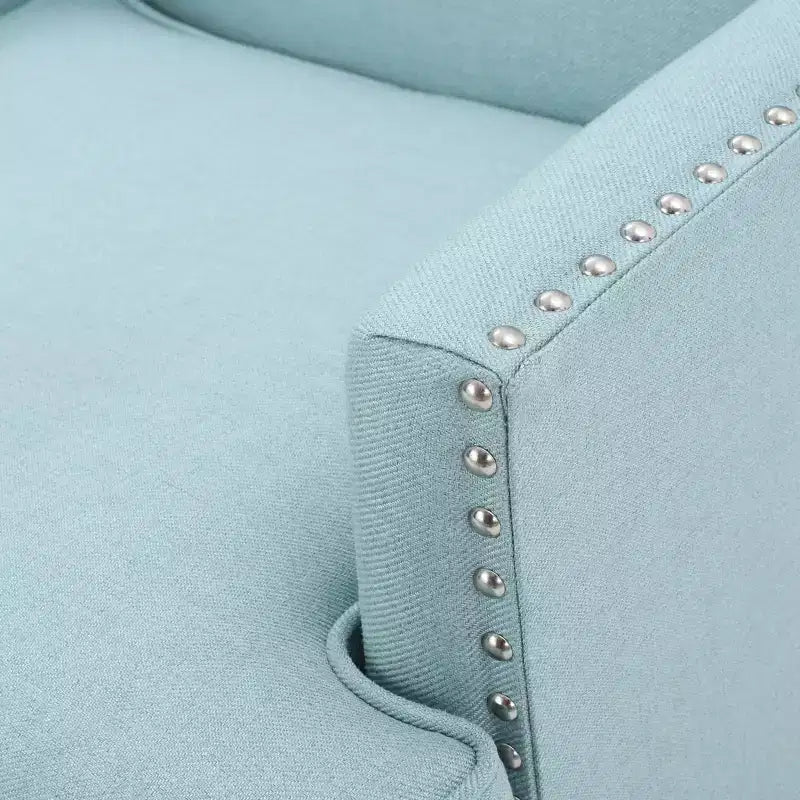 Fauteuil club contemporain GDFStudio Richardson en tissu rembourré avec clous décoratifs