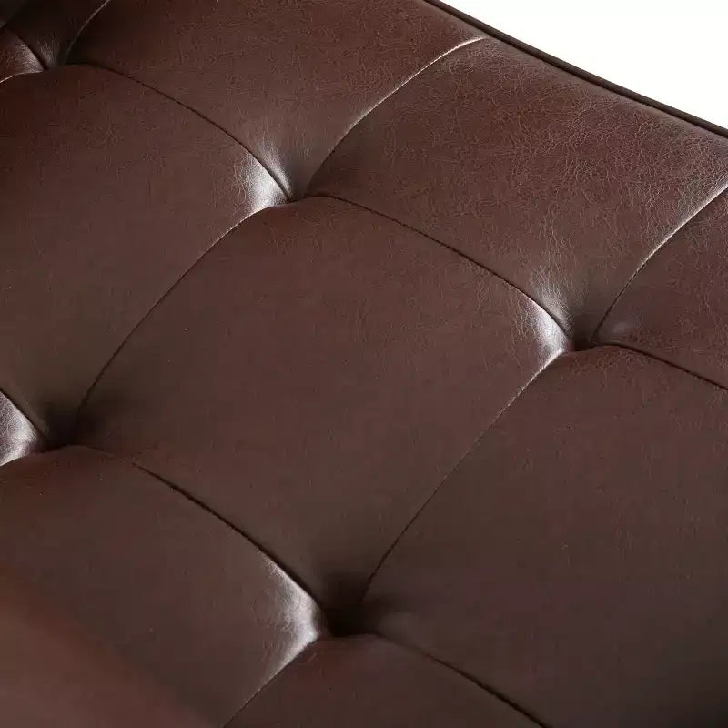Fauteuil club capitonné contemporain en similicuir GDFStudio Hixon avec traversins