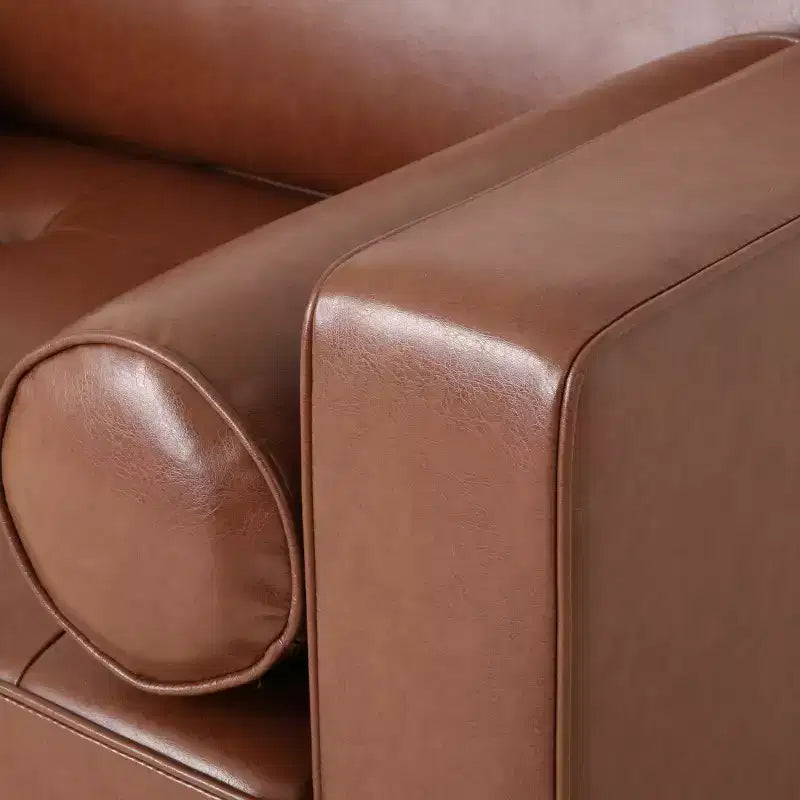 Fauteuil club capitonné contemporain en similicuir GDFStudio Hixon avec traversins