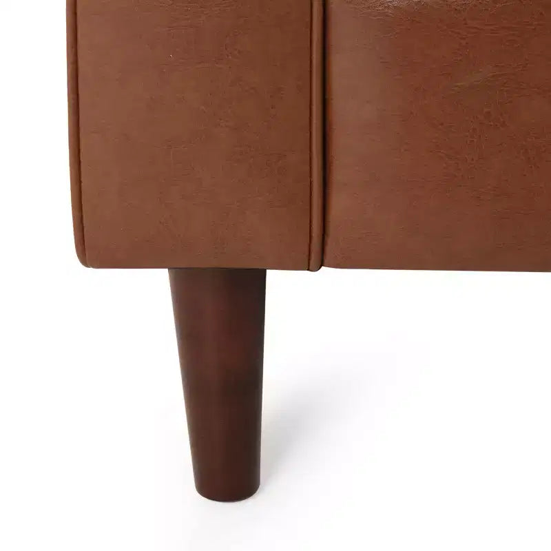 Fauteuil club capitonné contemporain en similicuir GDFStudio Hixon avec traversins