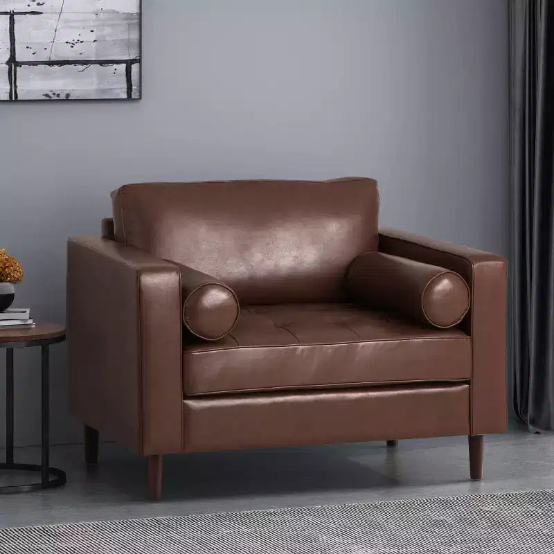 Fauteuil club capitonné contemporain en similicuir GDFStudio Hixon avec traversins